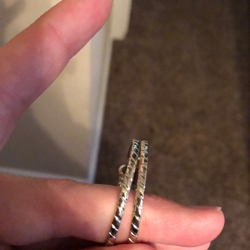 Silver earrings.